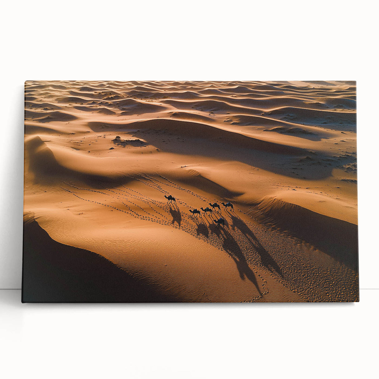 Stretched canvas artwork depicting a serene desert landscape with golden dunes under a vibrant sunset, ideal for adding warmth and tranquility to any space.