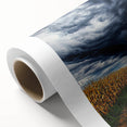 Vibrant rolled canvas depicting a serene landscape with lush green fields and a clear blue sky, designed for home decor in a protective cardboard tube.