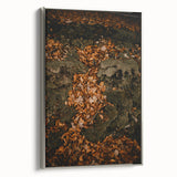 Framed canvas featuring a vintage-style landscape art painting of autumn trees in vibrant orange and red tones.