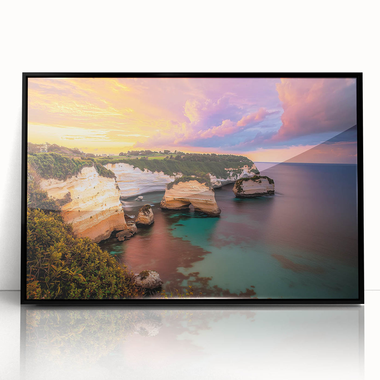 Framed acrylic artwork showcasing a stunning cliff landscape with vibrant colors and intricate details, set in a sleek black frame for a modern aesthetic.