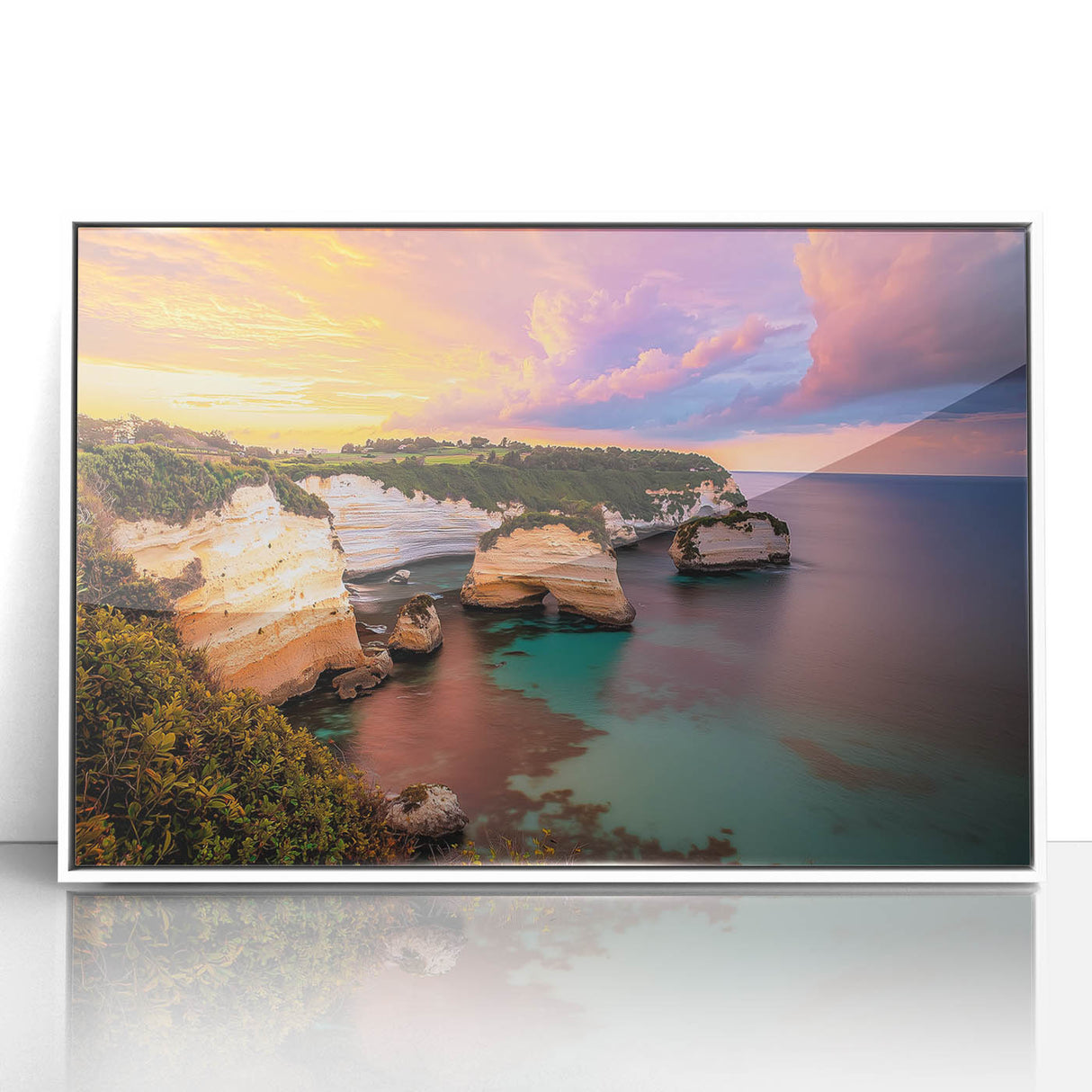 Framed acrylic artwork showcasing a dramatic cliff landscape in vibrant colors, set in a sleek white frame, perfect for enhancing modern home decor.