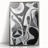 Framed acrylic artwork showcasing an abstract geometric design in silver hues, perfect for modern decor. The piece features sharp lines and a contemporary aesthetic, ideal for enhancing living spaces or offices.