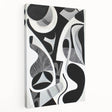 Abstract geometric stretched canvas artwork showcasing vibrant colors and intricate shapes, designed for modern home decor, highlighting its side view and texture.