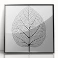 Large abstract wall art featuring close-up leaves in green and black, acrylic print in black frame.