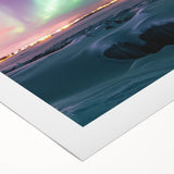 Rolled canvas art depicting a serene countryside landscape with rolling hills and a vibrant sunset, elegantly packaged in a protective cardboard tube for shipping.