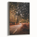 Framed canvas depicting a vintage-style landscape with autumnal trees in vibrant colors, ideal for living room decor.