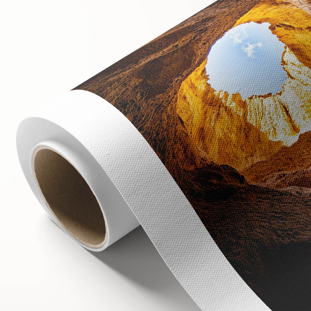 Vibrant rolled canvas showcasing a stunning landscape of colorful caves, featuring rich textures and hues, expertly packaged in a durable cardboard tube for safe transport.