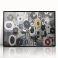 Framed acrylic wall art featuring an abstract geometric design in a sleek black frame, showcasing vibrant colors and sharp lines, perfect for modern decor.