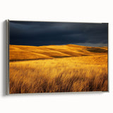 Framed canvas artwork depicting a serene countryside landscape with lush green fields and a clear blue sky, accented with a silver frame, ideal for home decor.