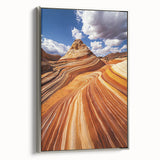 Framed canvas depicting a serene desert landscape with warm tones of orange and gold, showcasing a silver frame that enhances its elegance in any room decor.