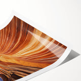 Desert landscape rolled print showcasing vibrant hues of orange and gold with dramatic mountain silhouettes, packaged securely in a durable cardboard tube for safe shipping.