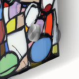Close-up of a vibrant abstract geometric design on acrylic glass, showcasing intricate patterns and bold colors, ideal for modern home decor and art enthusiasts.