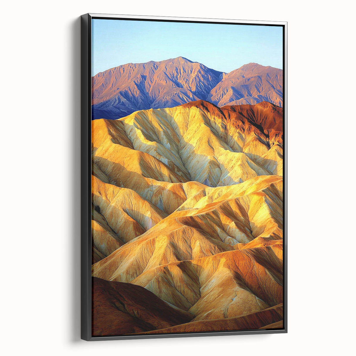 Framed canvas artwork showcasing a vibrant desert landscape with warm hues of orange and yellow, featuring a sleek black frame, ideal for modern home decor.