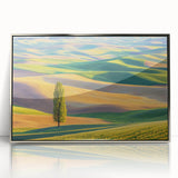 Framed acrylic artwork depicting a serene landscape of rolling fields under a clear blue sky, featuring vibrant green hues and a modern silver frame, perfect for home decor.