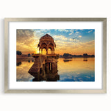 Textured abstract art print depicting a serene Indian landscape in muted earth tones, framed in silver.
