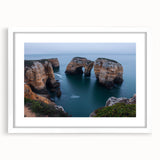 Framed landscape artwork showcasing dramatic cliffs, surrounded by a white mat, perfect for home decor. Ideal for nature lovers seeking elegant wall art.