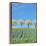 Framed canvas art depicting a serene landscape with golden hues and vibrant fields, showcasing a side view that highlights its elegant design and texture. Perfect for enhancing interior decor.