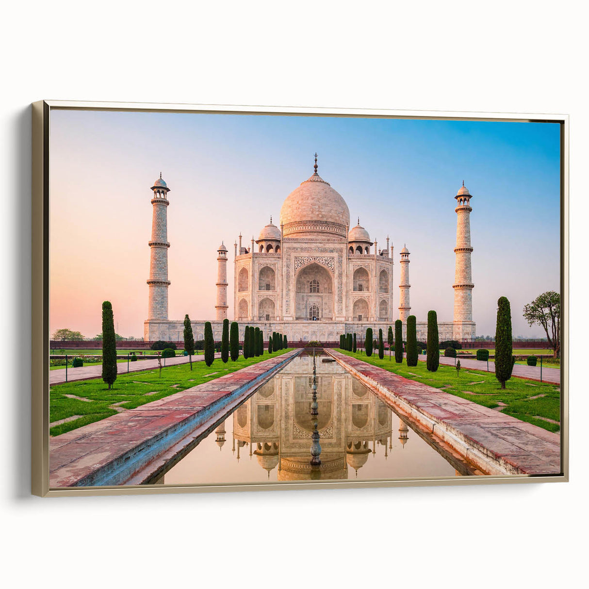 Framed canvas featuring a vintage-style landscape painting of an Indian scenery in gold and black tones.