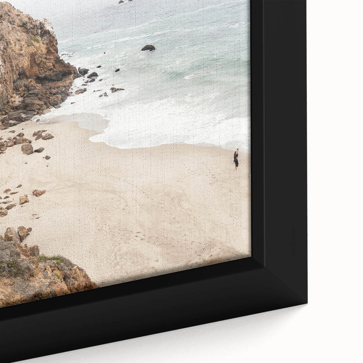 A close-up of textured black wall art featuring vibrant, colorful abstract patterns on a framed canvas.
