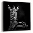 Framed canvas artwork showcasing a detailed animal design with a black border, viewed from the side, perfect for home decor or wildlife enthusiasts.