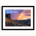 Black-framed landscape artwork depicting a serene desert scene with a mat, showcasing warm tones of orange and beige, perfect for home decor enhancement.