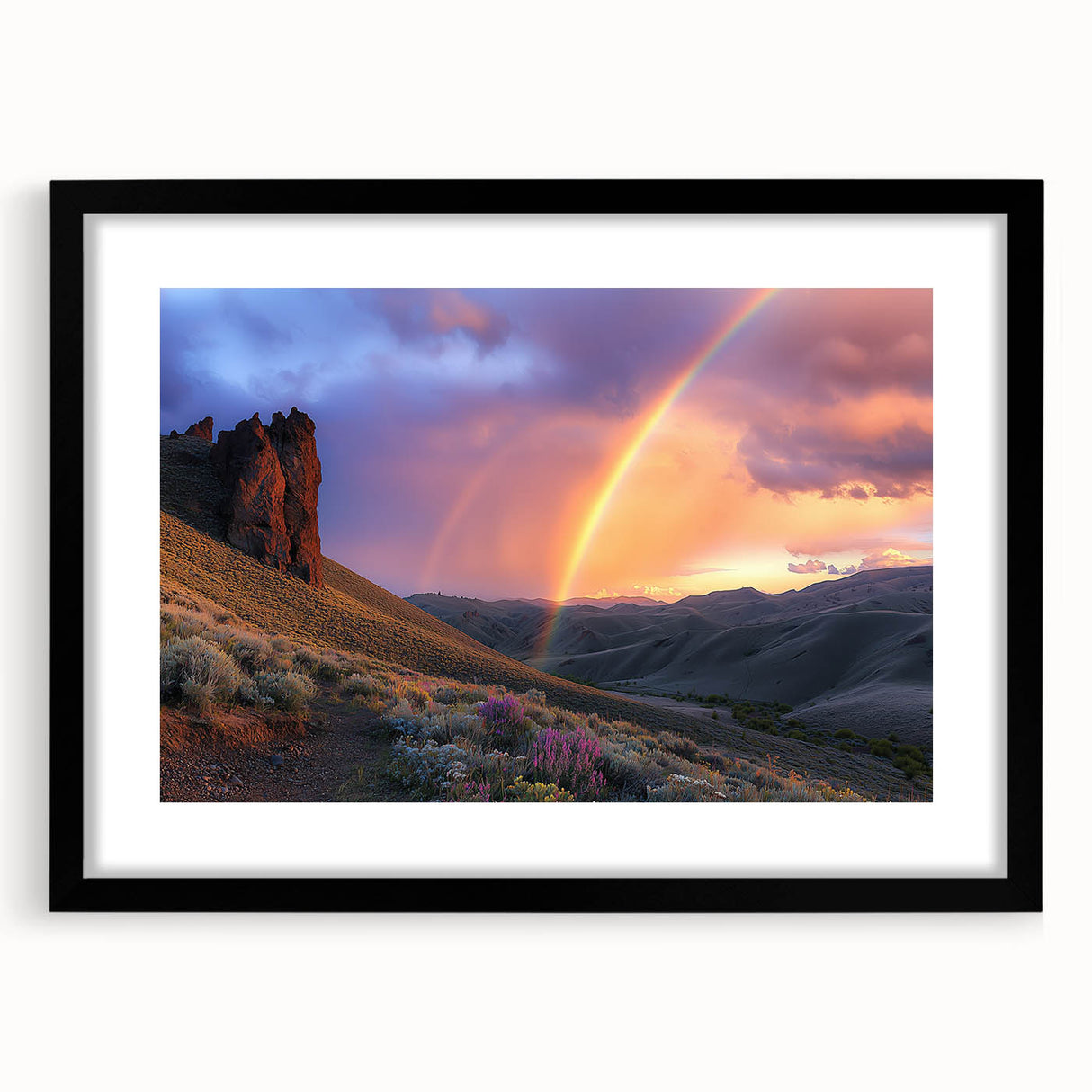 Black-framed landscape artwork depicting a serene desert scene with a mat, showcasing warm tones of orange and beige, perfect for home decor enhancement.