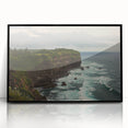 Framed acrylic artwork depicting a dramatic cliffside landscape, featuring vibrant colors and intricate details, perfect for modern home decor or office spaces.