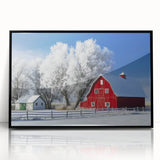 Framed acrylic artwork showcasing a scenic landscape with a barn, highlighted by vibrant colors and a sleek black frame, perfect for home decor.