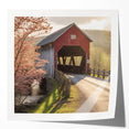 Covered bridge in autumn portrayed on a glossy photo print, utilizing earthy red and orange tones.