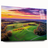 Acrylic landscape art showcasing a serene countryside view, displayed in a glass frame without pins, highlighting vibrant green fields and a clear blue sky.