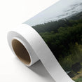 Rolled canvas showcasing a vibrant landscape barn design, featuring rich colors and intricate details, securely packaged in a durable tube for safe transport.