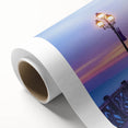 Rolled canvas showcasing a vibrant landscape bridge design, featuring rich colors and intricate details, securely packaged in a durable cardboard tube for safe delivery.