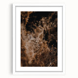 Abstract art print featuring swirling autumn colors on a white framed canvas, ideal for dining room ambiance.