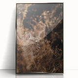 Mid-century modernist art depicting autumn trees in earthy tones on a silver-framed acrylic print.