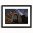 Framed landscape artwork showcasing a majestic castle surrounded by lush greenery, elegantly displayed with a black mat for a sophisticated look.