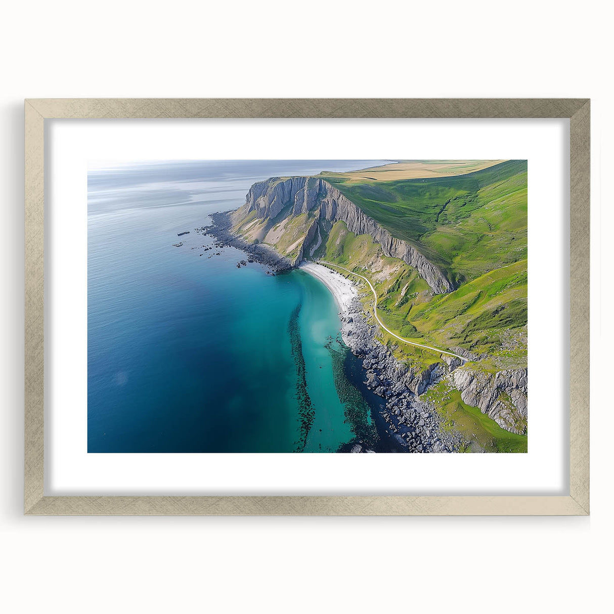 Framed landscape artwork showcasing dramatic cliffs and serene ocean views, featuring a silver mat for an elegant finish, ideal for modern home decor.