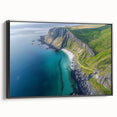 Framed canvas artwork depicting a dramatic cliff landscape with rich colors and textures, featuring a sleek black frame for a modern touch, ideal for home decor.
