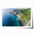 Vibrant rolled print of a scenic landscape showcasing dramatic cliffs and a serene sky, designed for wall decor, presented in a protective cardboard tube.