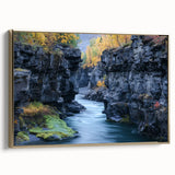 Framed canvas artwork depicting a stunning landscape of canyons, featuring rich earthy tones and a gold frame, ideal for modern home decor and art enthusiasts.