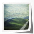 Glossy mockup of a countryside landscape photo print showcasing vibrant green fields and a clear blue sky, ideal for home decor or art displays. The print features rich colors and fine details, enhancing its visual appeal.