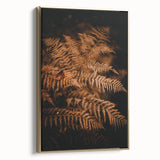 Framed canvas wall art depicting a vintage-style landscape with fall trees in muted gold and black tones.