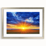 Silver-framed landscape artwork displaying vibrant green fields under a blue sky, elegantly matted to enhance its beauty, perfect for home decor or office spaces.