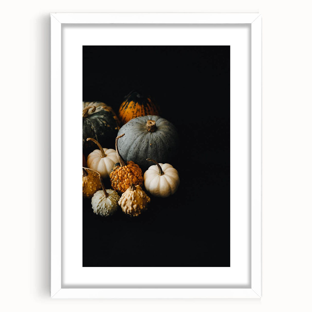 Abstract art print featuring swirling autumnal hues on a white framed canvas, suitable for dining room or bedroom decor.