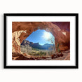 Framed desert landscape artwork with a black matte frame, showcasing vibrant sandy hues and striking mountain silhouettes, perfect for home décor.