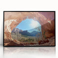 Framed acrylic artwork showcasing a vibrant desert landscape, featuring warm hues of orange and brown, set in a sleek black frame for modern decor.