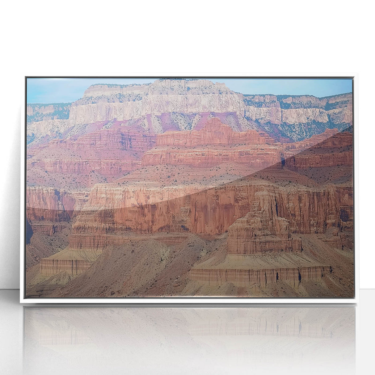 Framed acrylic artwork showcasing a stunning landscape of canyons, featuring vibrant colors and intricate details, perfect for enhancing home decor. The white frame adds elegance, making it an ideal centerpiece for any room.