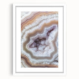 Abstract art print featuring swirling patterns in muted earth tones, framed with a white mat.