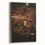 Framed canvas featuring a vintage poster-style landscape painting with fall scenery in muted gold and black tones.