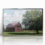 Framed acrylic wall art showcasing a serene landscape scene with a barn, highlighted by silver accents. Perfect for home decor, this artwork adds rustic charm to any space.