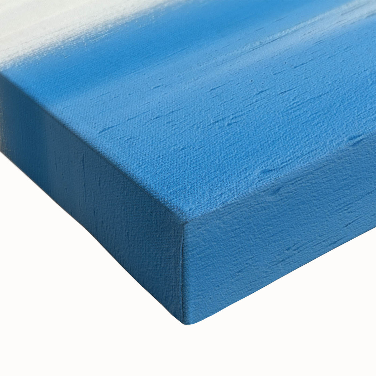 Close-up of a stretched canvas art piece depicting a serene countryside landscape, showcasing vibrant green fields, rolling hills, and a clear blue sky, ideal for home decor.